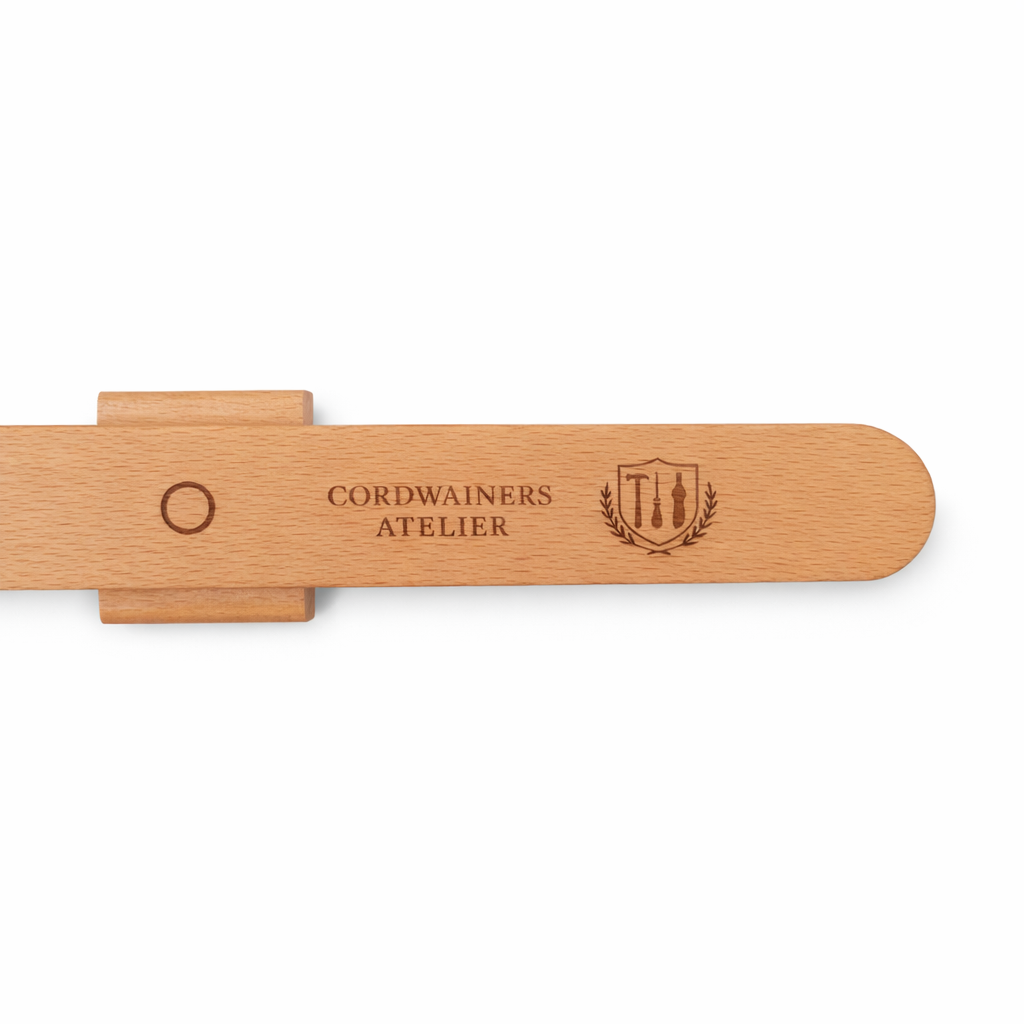 Magnetic wall mounted wooden shoe horn for convenient everyday shoe wearing