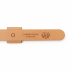 Magnetic wall mounted wooden shoe horn for convenient everyday shoe wearing