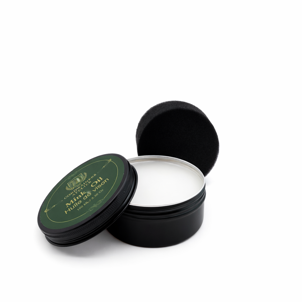Black tin with green label on a white background