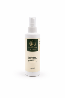 White spray bottle with a label on a white background, for cleaning all sorts of leather material, non toxic material
