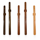 Magnetic wooden shoe horn mounted on wall for easy shoe wearing
